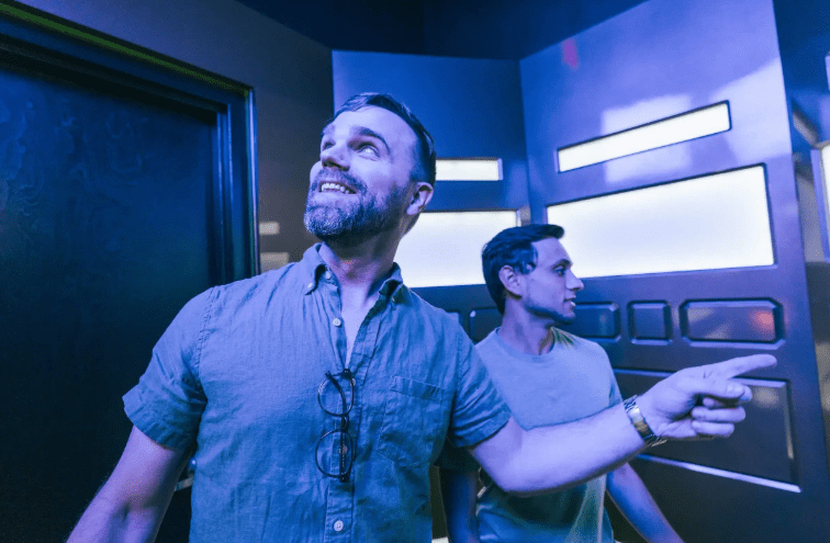 two men inside escape room
