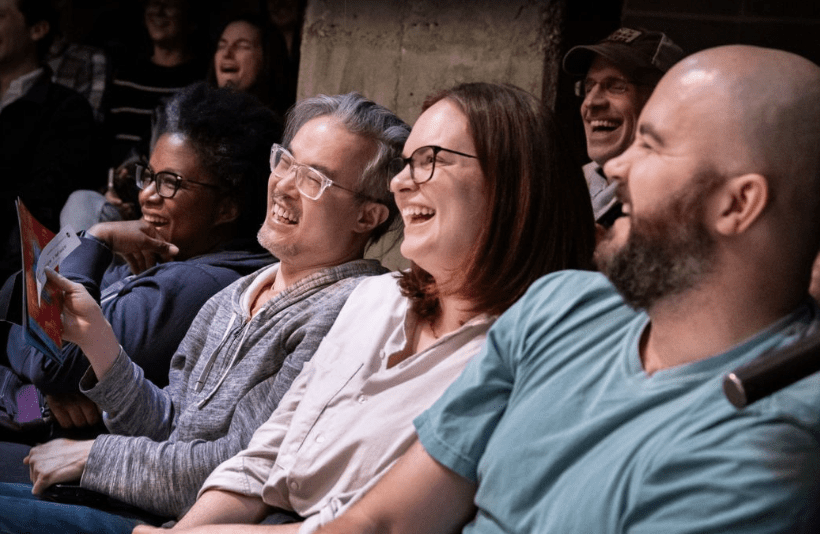 crowd of people laughing